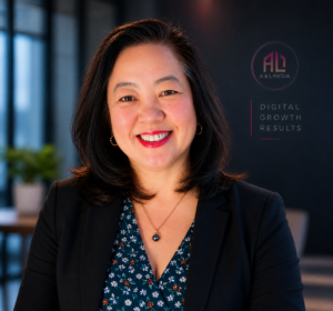 Professional headshot of Le Doan, owner of A & L Media, smiling in a modern office setting with subtle A & L Media branding and the words “Digital Growth Results” in the background